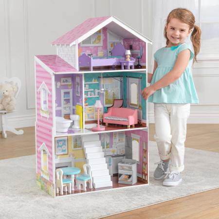 Niña jugando con la preciosa kidkraft casa de muñecas glendale manor 65940